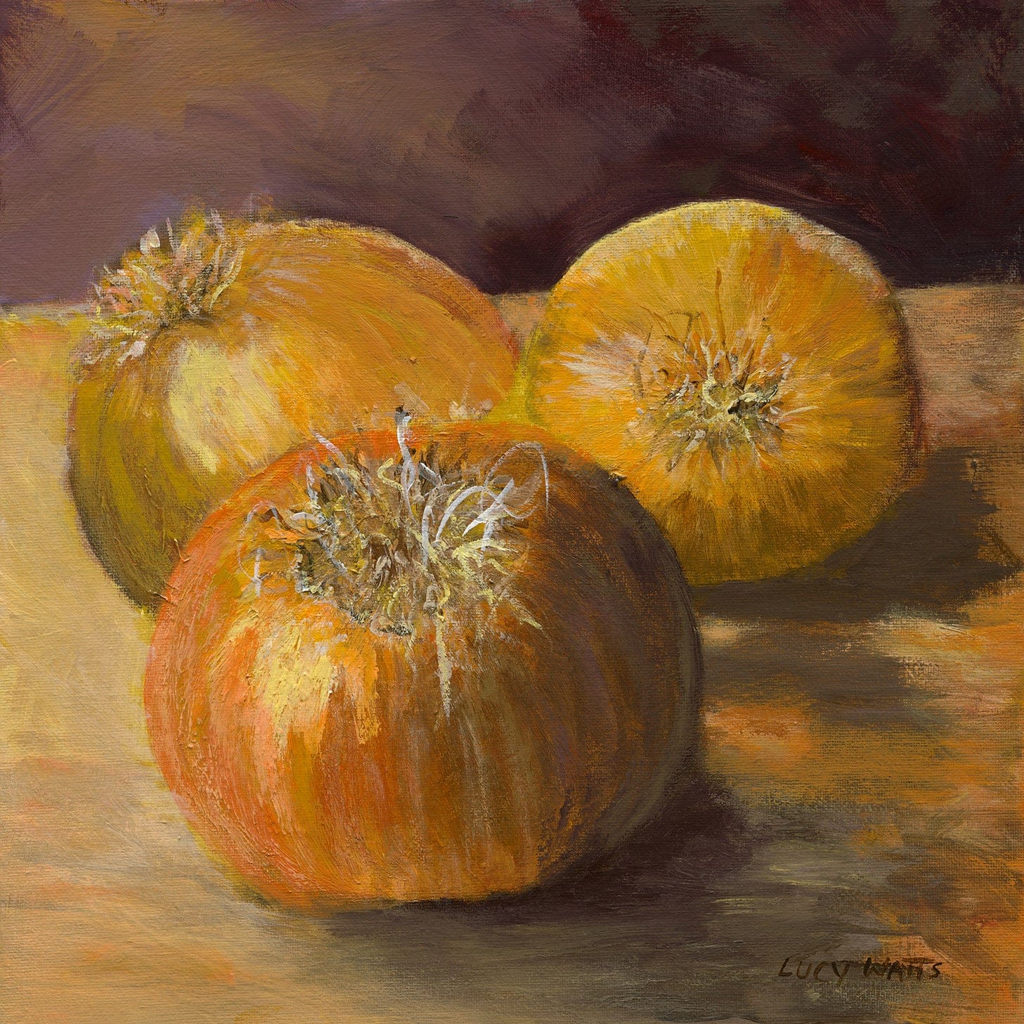 Framed painting of three pumpkins on a white wall