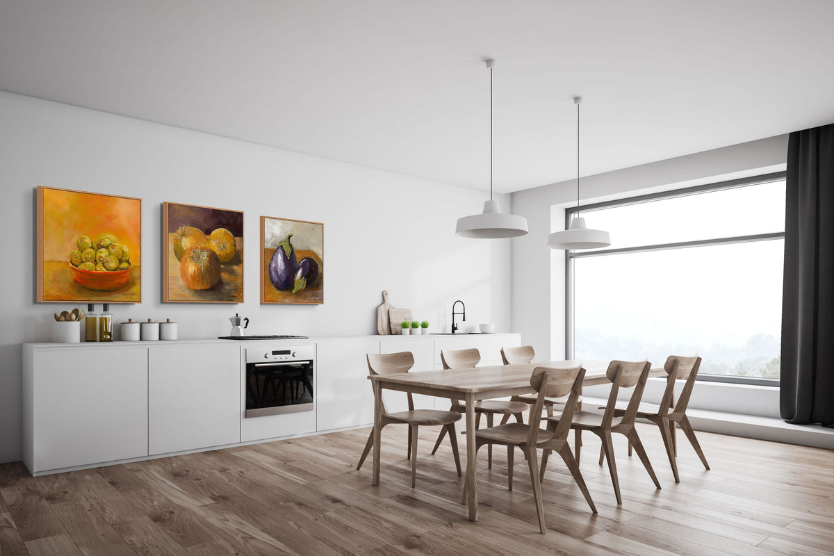 Modern kitchen with dining area featuring a table and chairs, and wall art.