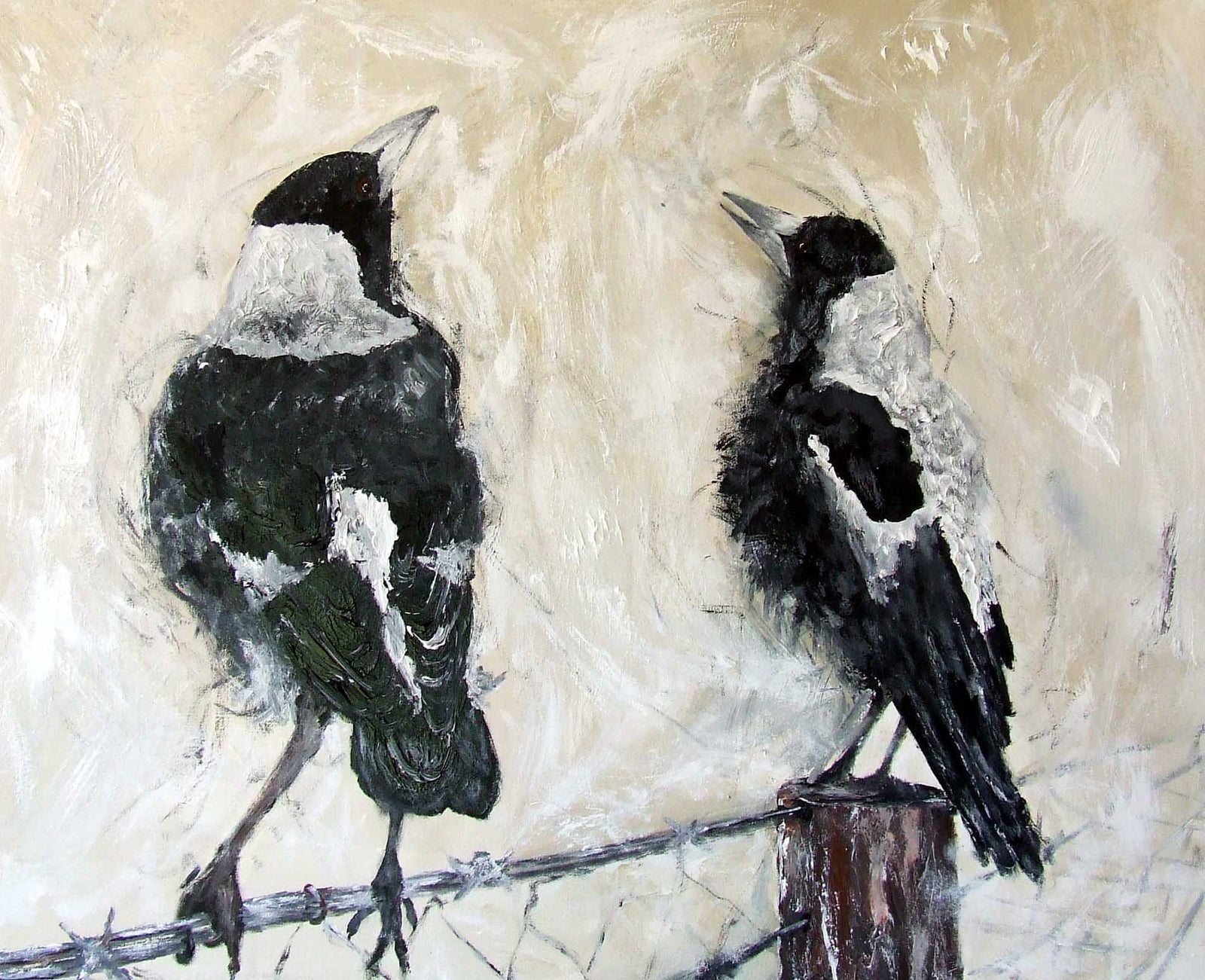 Two black and white birds perched on a wire against a textured beige background