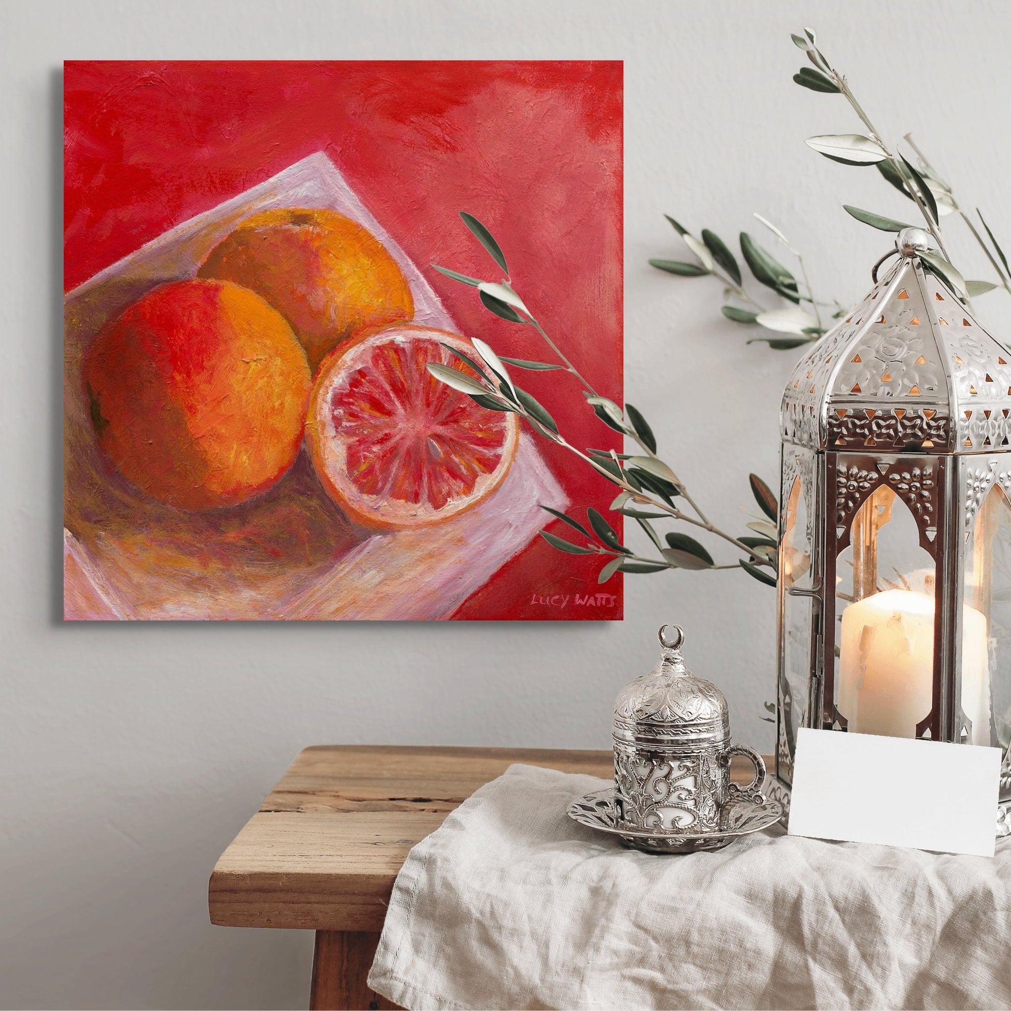  Print of painting by  Australian artist Lucy Watts of ruby grapefruit on white plate with warm tone background.