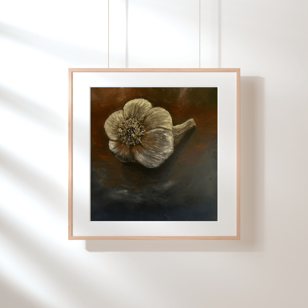 Framed artwork of a dried flower on a white wall