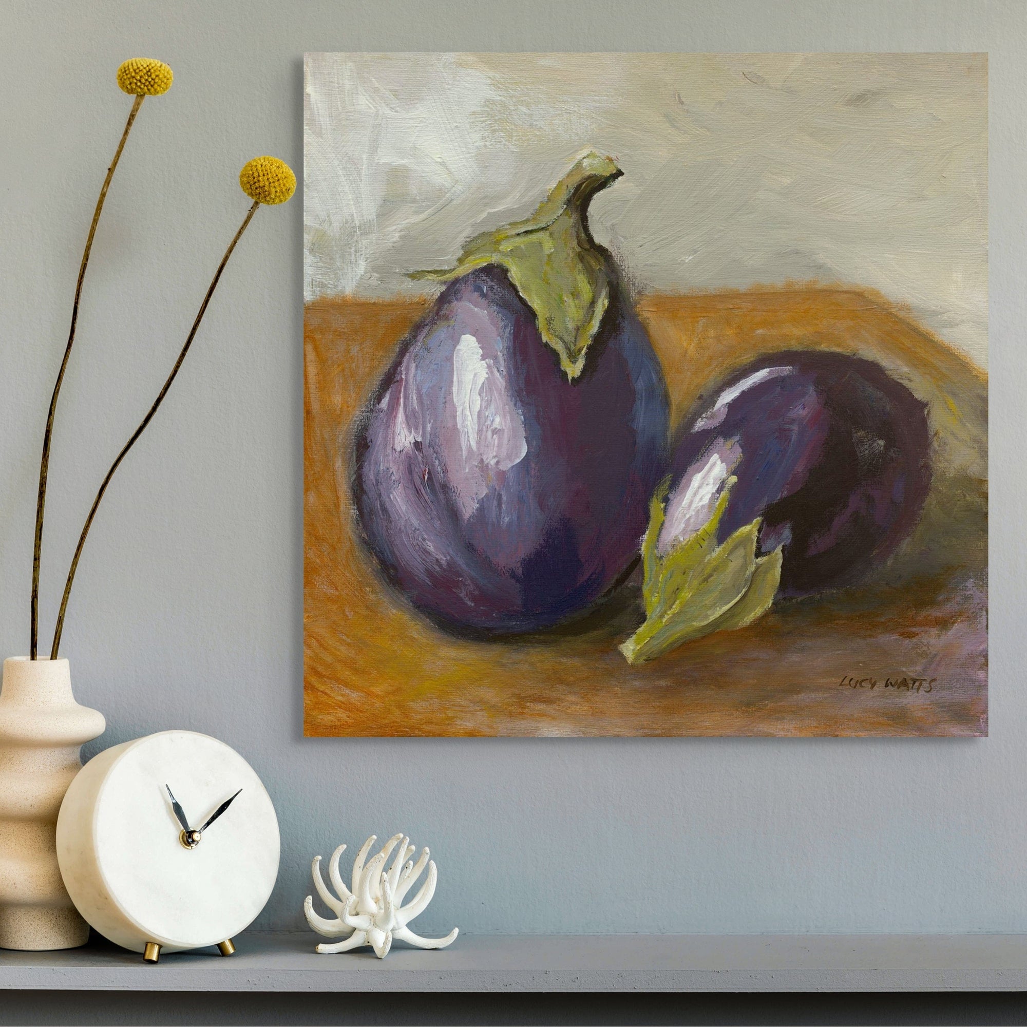 Painting of two eggplants on a textured surface by Lucy Watts