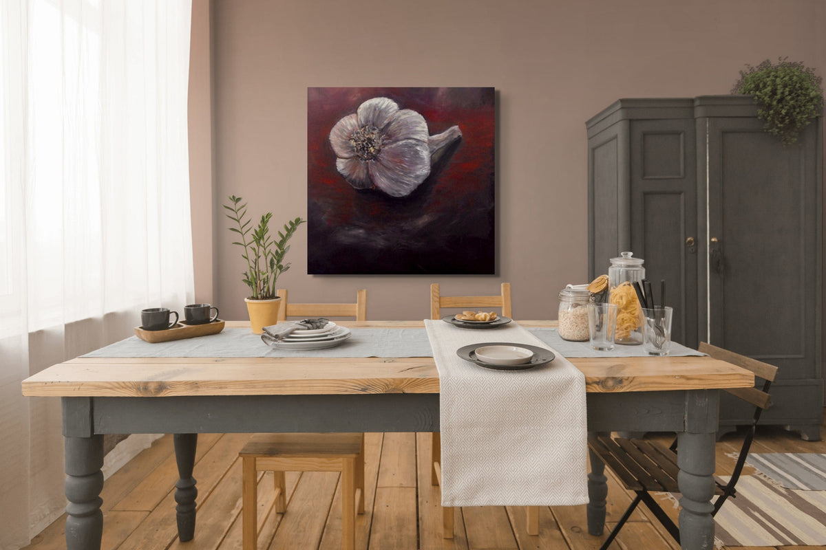 Dining room with a wooden table set for a meal, a painting on the wall, and a cabinet.