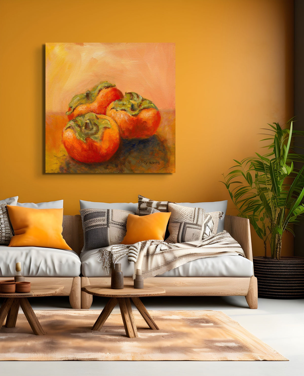 Living room with a couch, coffee table, and painting of persimmons on an orange wall.
